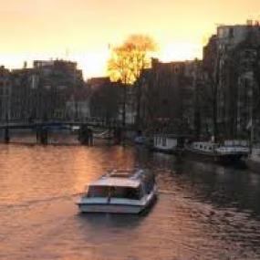Enjoy Amsterdam on river which surround city.